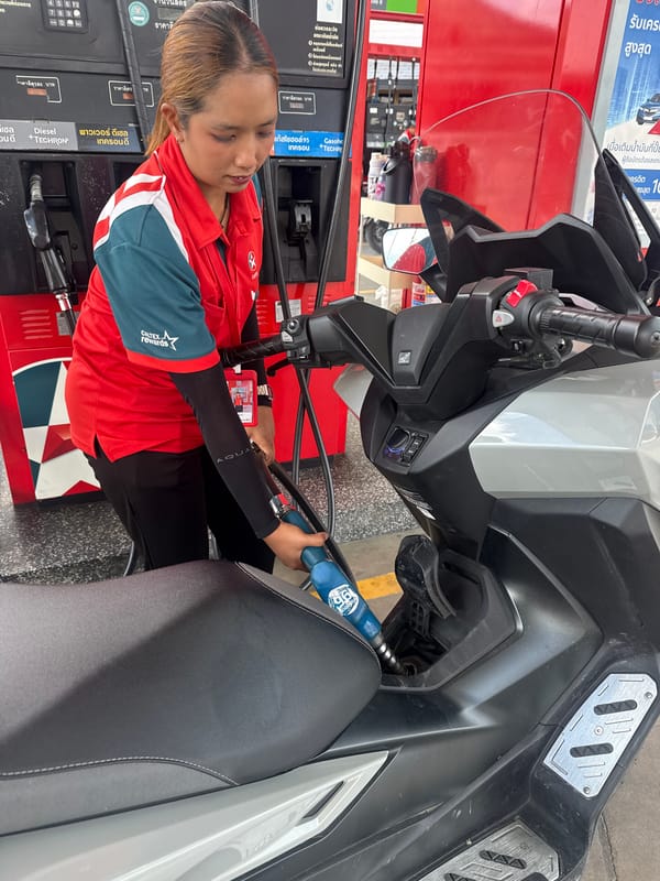 Scooter refuels at Caltex station in Ko Samui