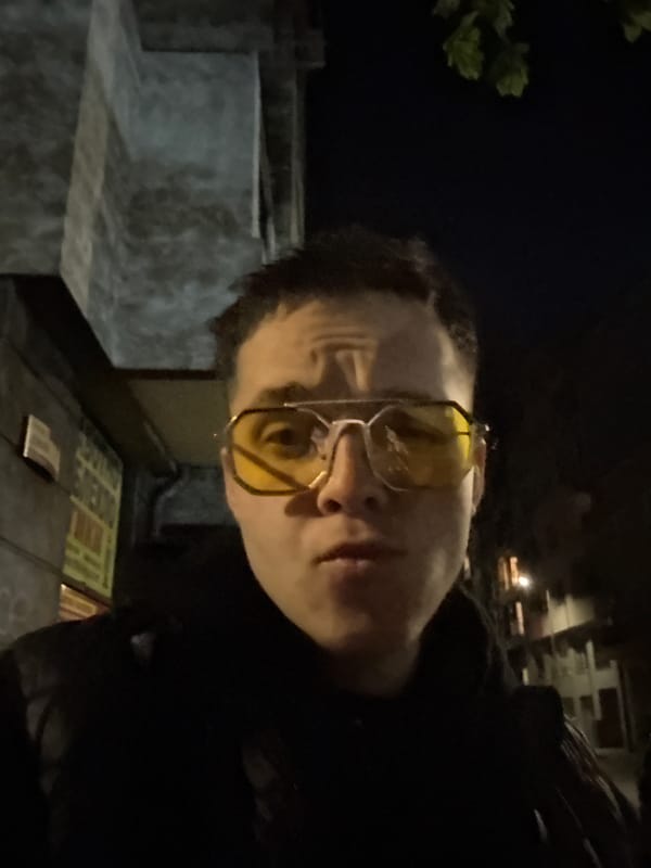 Person with yellow glasses spotted holding sandwich in Sofia