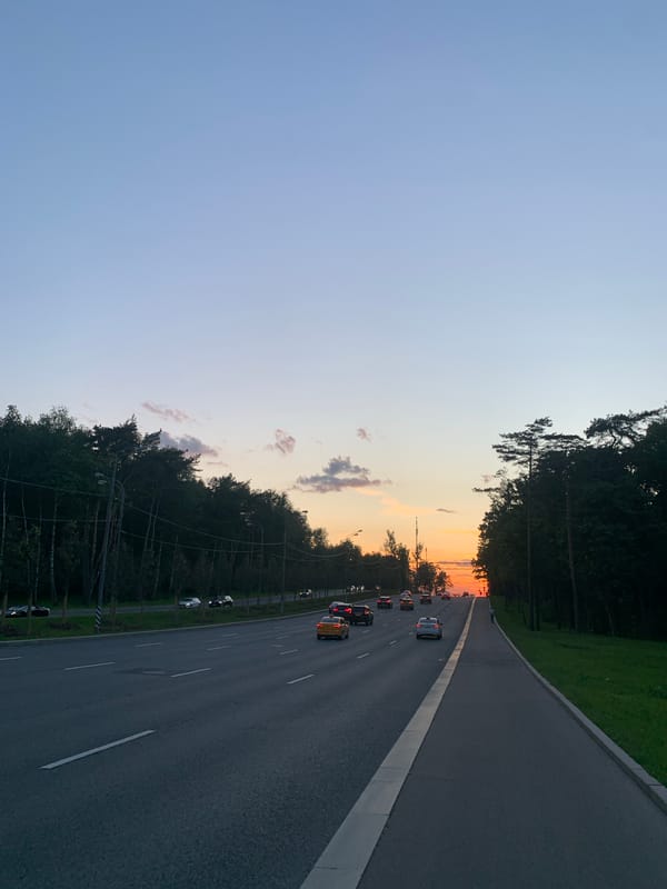 Highway sunset scene documented by witnesses during evening hours