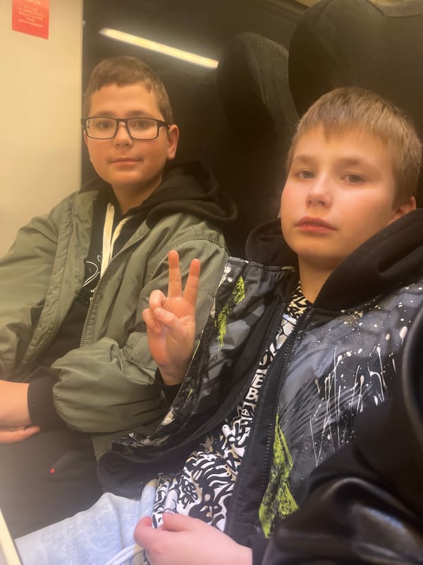 Children take selfie together indoors in Sochi, Russia