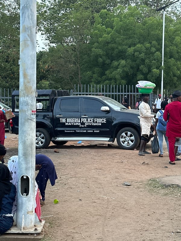 Evening street life documented around Transcorp Hilton in Abuja