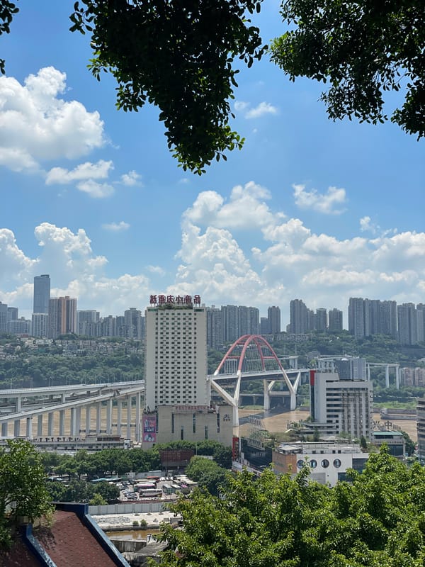 Yuzhong District streets buzzing with buses, taxis, and traffic