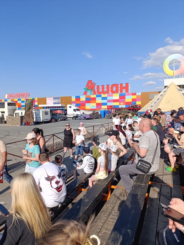Mixed outdoor gatherings feature military vehicle, monster trucks, personal moments