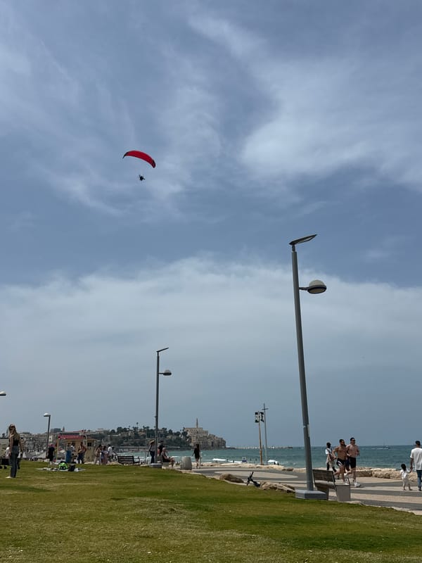 Paraglider spotted over Tel Aviv coast on sunny morning