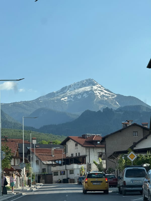 Clear skies, snow-capped peaks frame Bansko mountain views