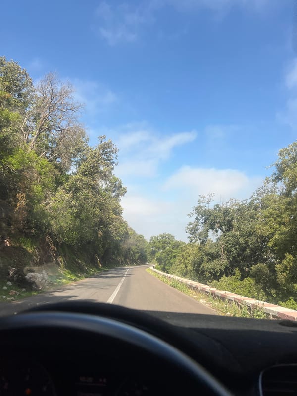 Vehicle journey documented on winding roads in Ouaouizert, Morocco
