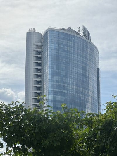 Modern glass building observed in Kyiv with reflective facade