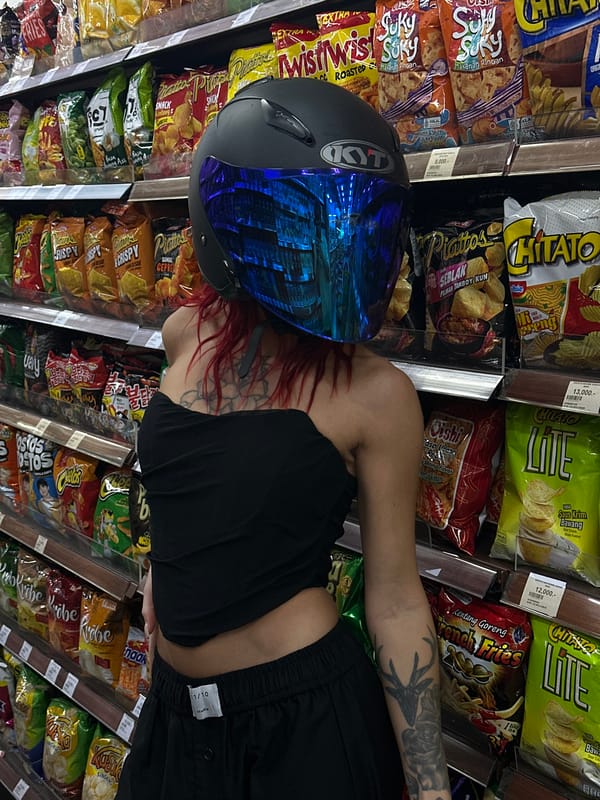 Woman shops for snacks in North Kuta grocery store