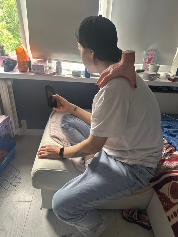 Person with smartphone observed on ottoman in Stavropol