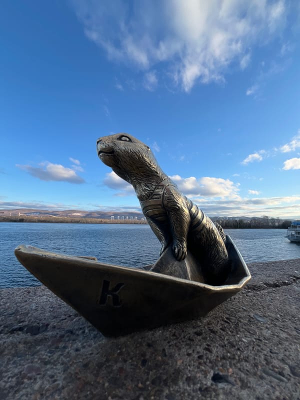 Tourist captures Krasnoyarsk riverfront sculptures and bridge views