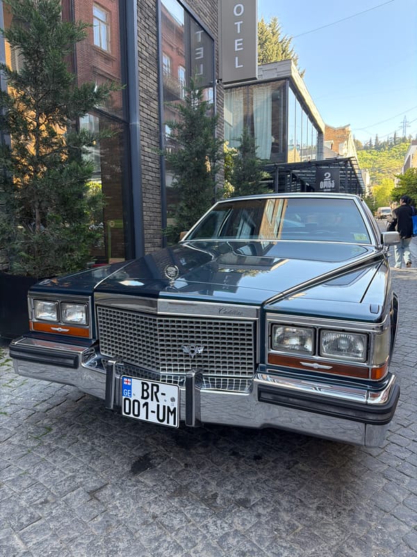 Blue Cadillac spotted near Saint George statue in Tbilisi