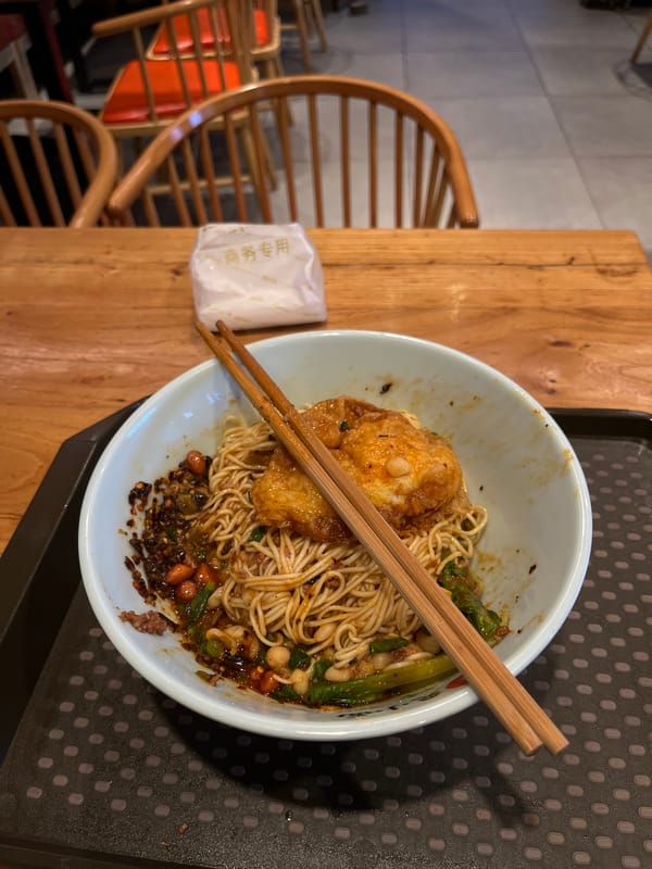 Noodle meal documented at Chongqing restaurant during lunch hour