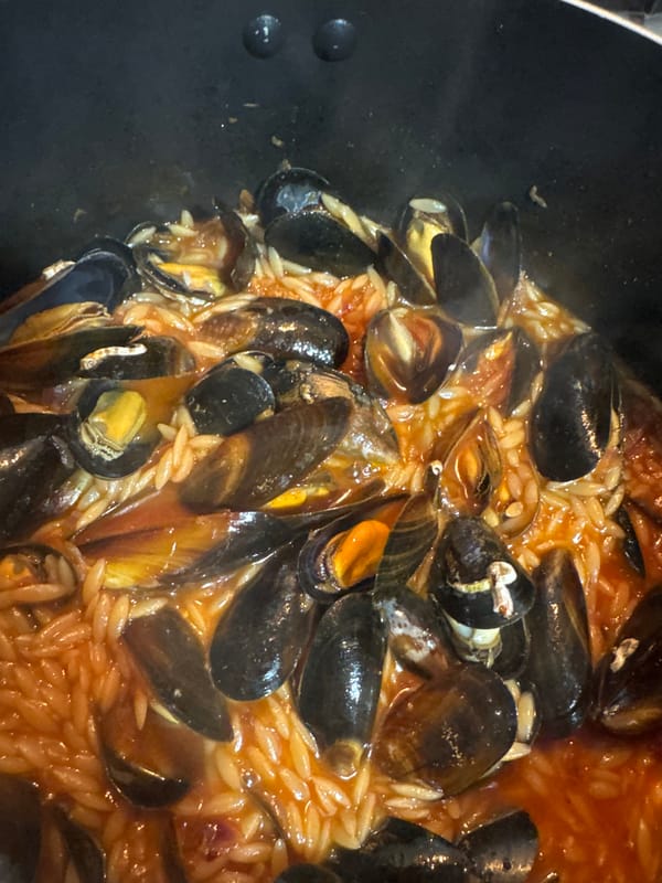 Home cooking: mussel pasta preparation in Desborough evening