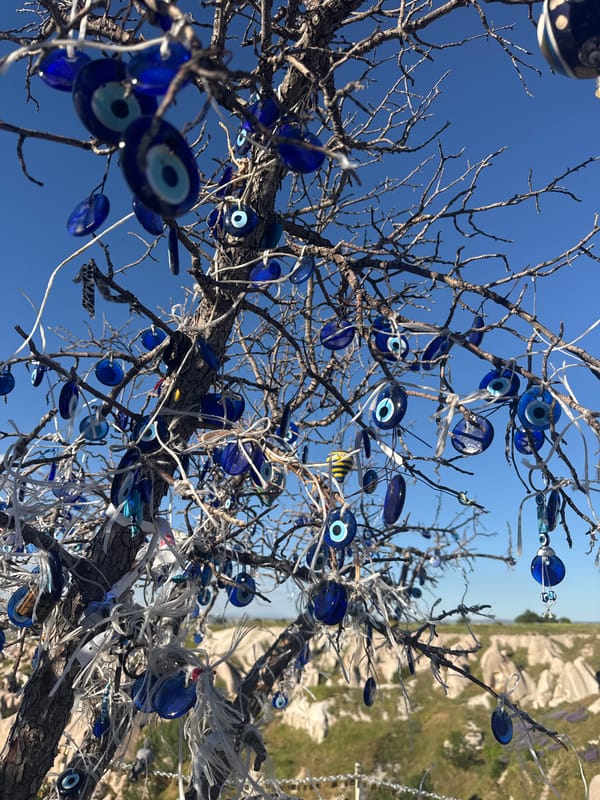 Afternoon in Uçhisar: fairy chimneys, nazar charms, and overlook views