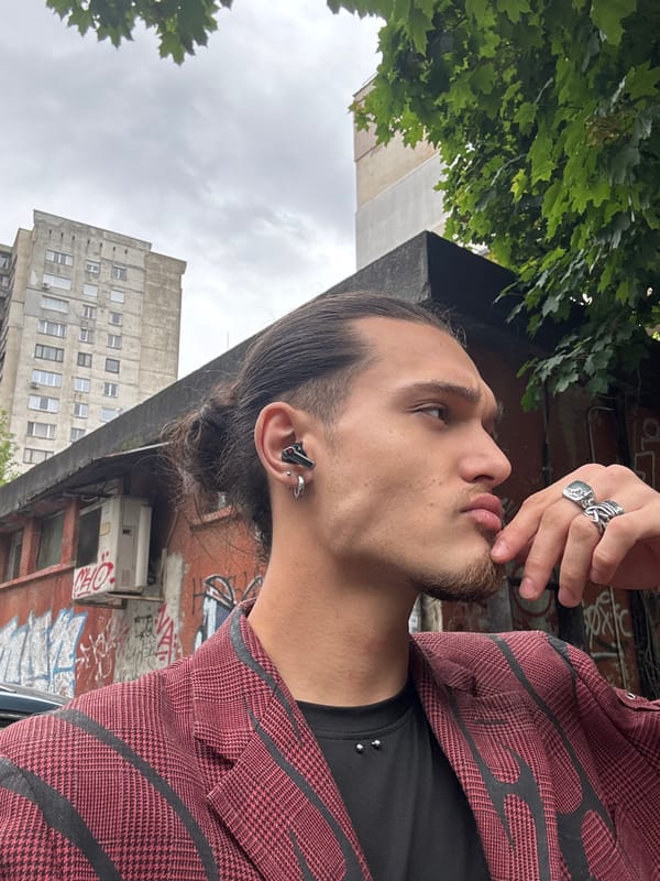 Young man in plaid blazer spotted on Sofia sidewalk