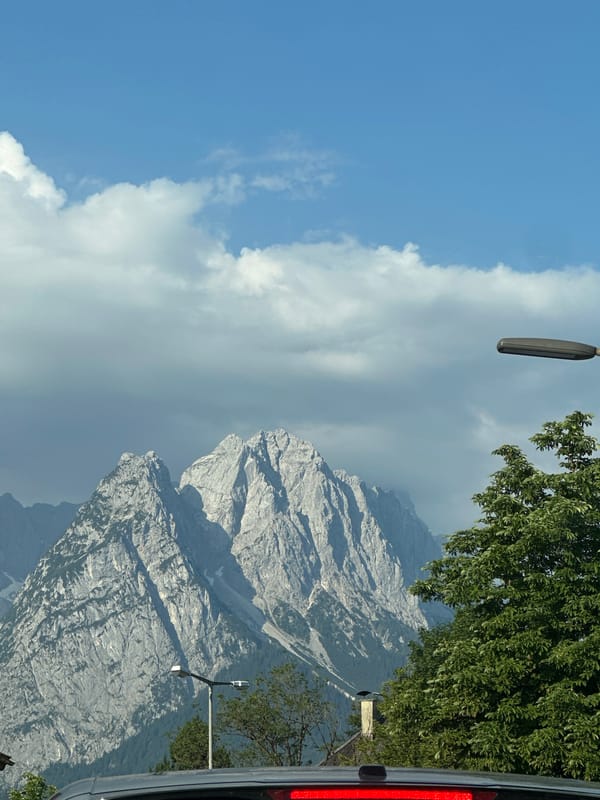 Traffic jam in Garmisch-Partenkirchen with Zugspitze in the backdrop
