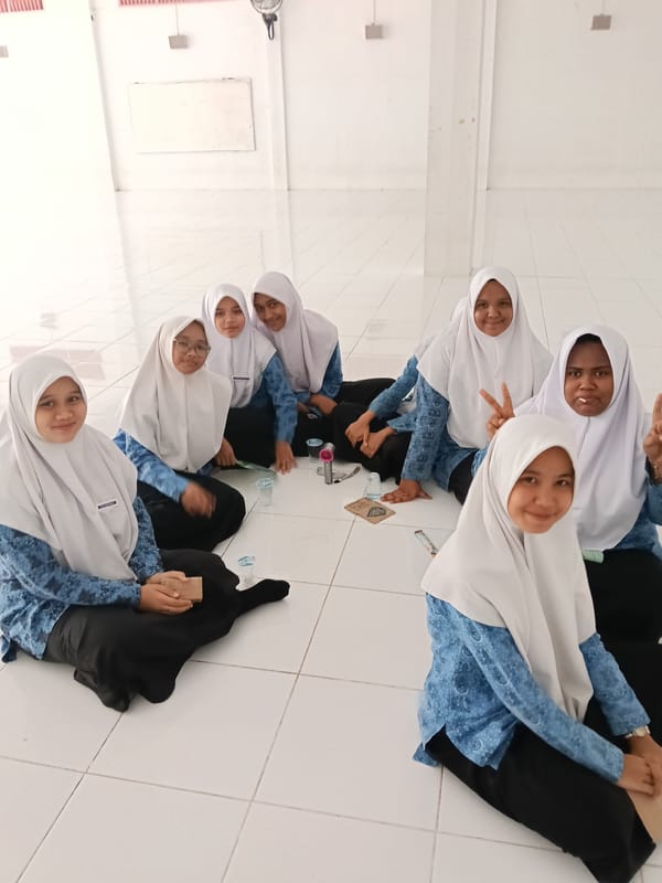 Seven women gather indoors at Lhokseumawe building early morning