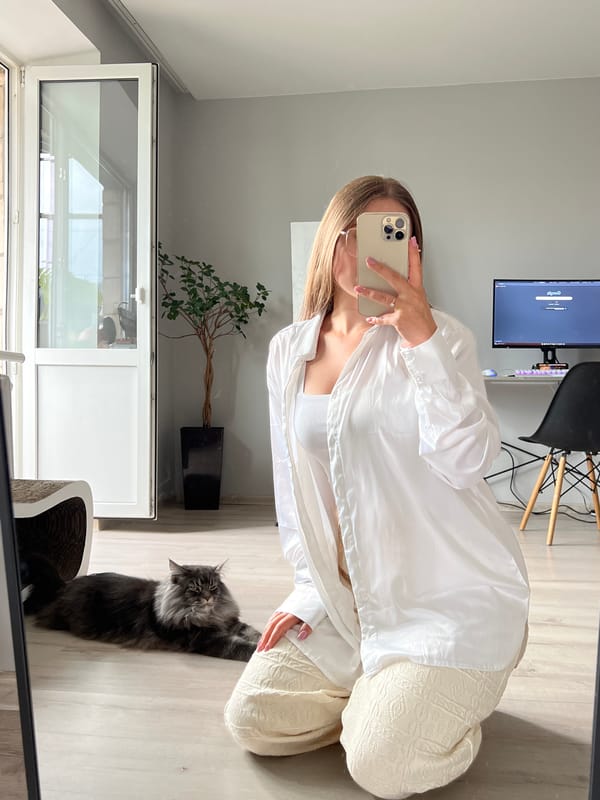 Mirror selfie session in a Ternopil apartment, cat included