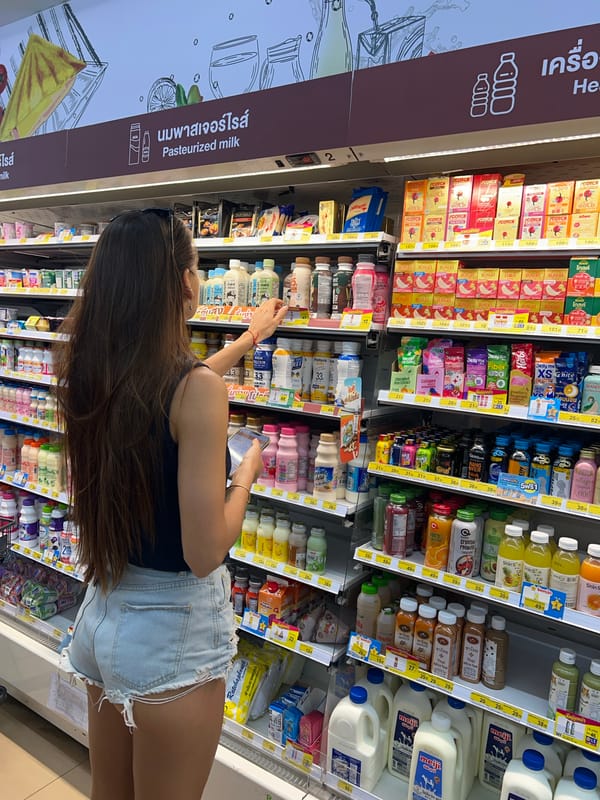 Woman shops at convenience store in Baan Lipa Noi
