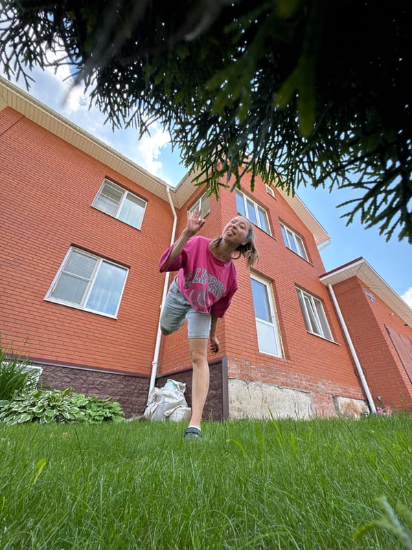 Woman enjoys casual morning outdoors with dog in Prikamsky