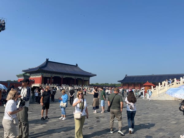 Crowds gather at Beijing's Temple of Heaven on a clear day