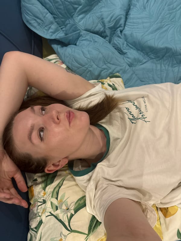 Woman and kitten share quiet domestic moments in Izhevsk bedroom