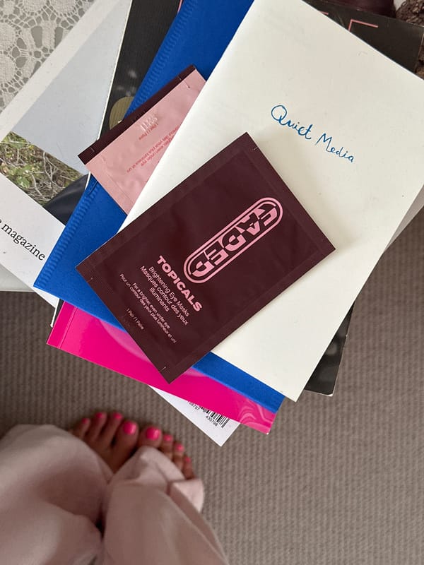 Handwritten 'Quiet Media' envelope photographed on book stack in Tunbridge Wells