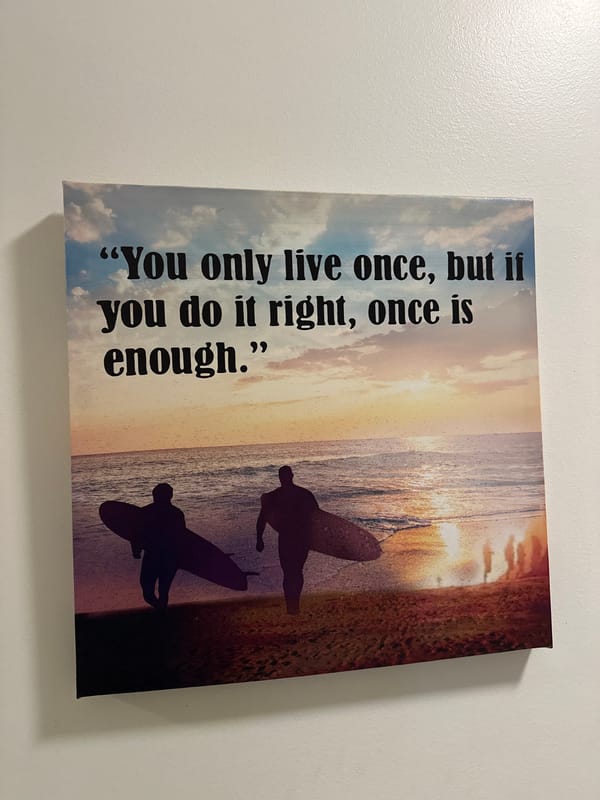 Beach-themed inspirational canvas art spotted on Sofia wall