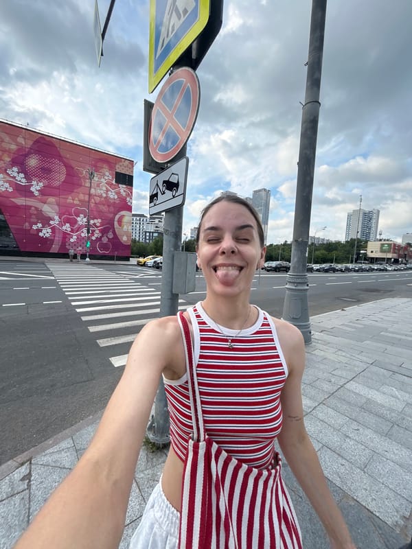 Selfie and street crossing, same outfit, same moment