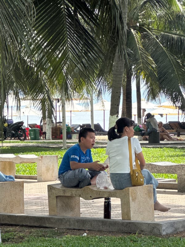 Beachside evening in Nha Trang — benches, stalls, and games