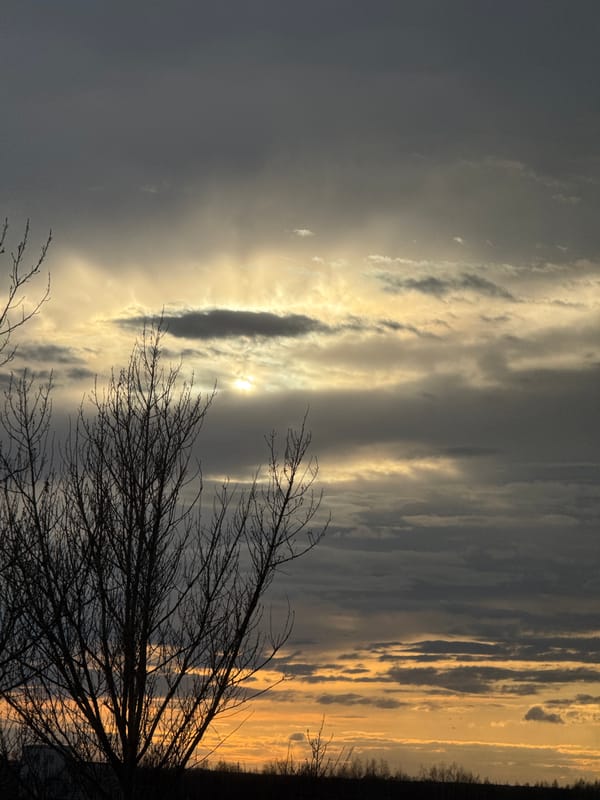Dramatic sunrise or sunset sky captured with silhouetted landscape