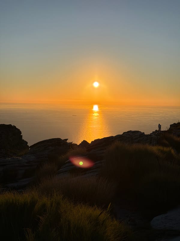 Sunset photographed from Cape Town clifftop overlooking ocean