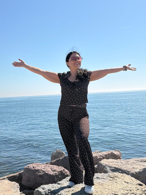 Woman poses on Kadıköy coastline during sunny afternoon outing