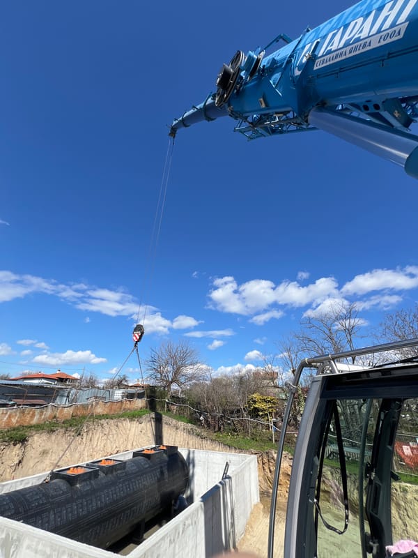 Crane lifts pipe section in Priseltsi infrastructure work