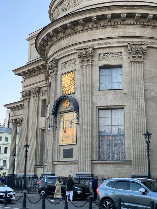 Tourist documents Saint Petersburg cathedral architecture during evening walk