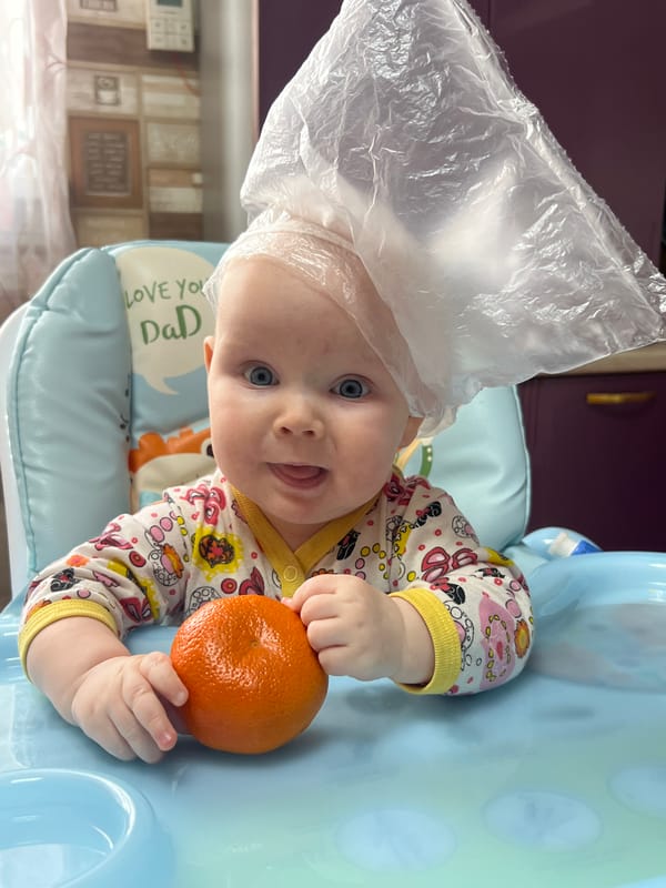Baby photographed in high chair in Votkinsk, Russia
