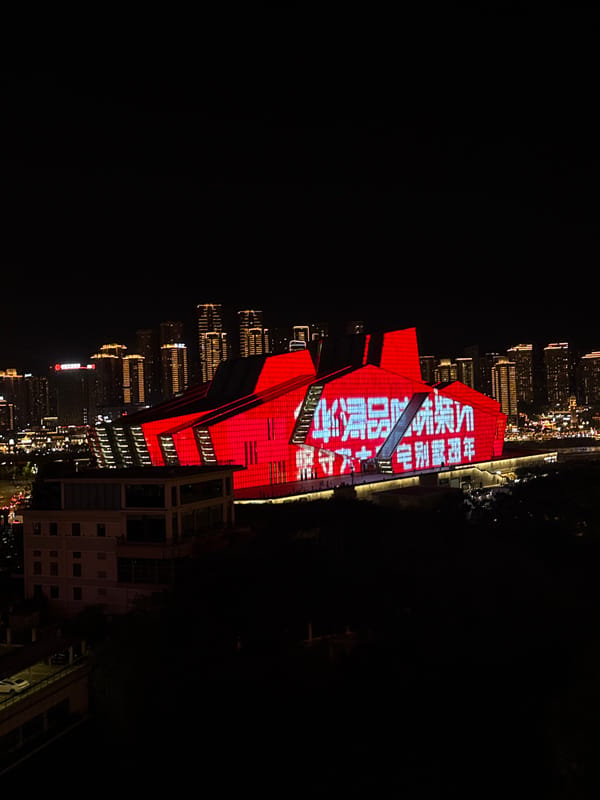 Chongqing's Jiangbeicheng waterfront glows on a summer night