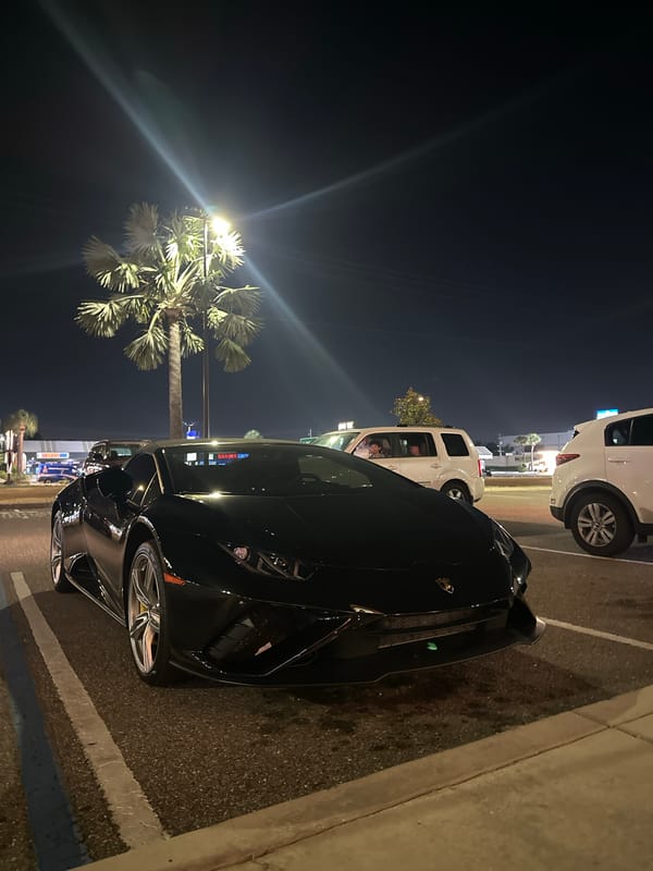 Black Lamborghini spotted parked on Tampa street at night