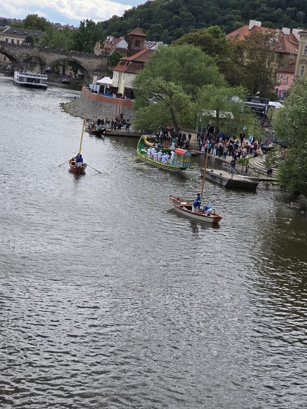 Prague river traffic documented near Charles Bridge during midday
