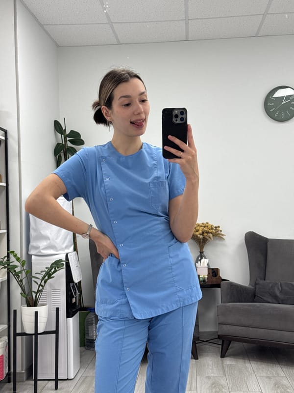 Woman takes mirror selfies in office waiting room