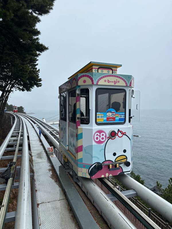 Monorail cars spotted on wet coastal tracks in Busan