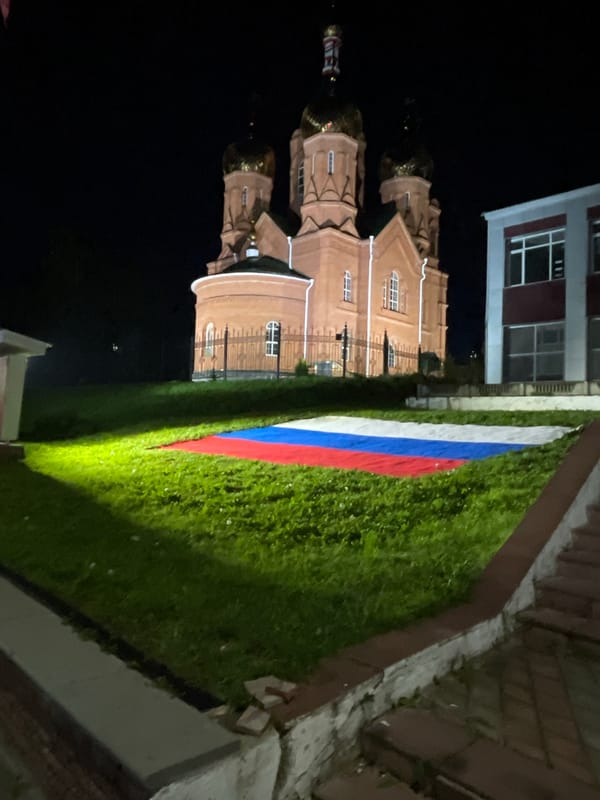 Nighttime photos captured in Красные Баки showing church, flowers