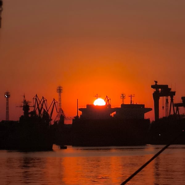 Sunset over Varna Port, ships, sailboats, and fresh catch