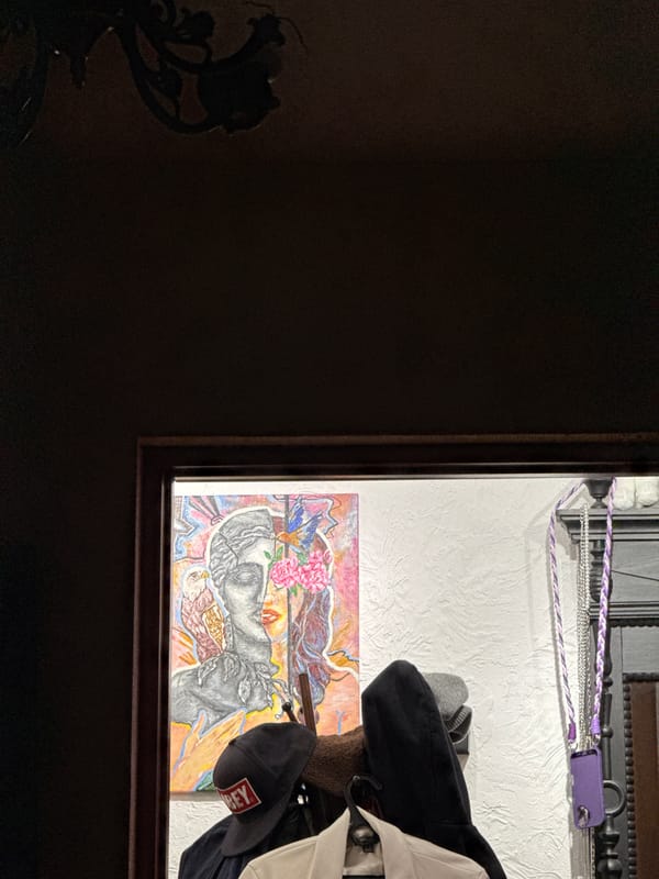 Colorful crowned figure artwork spotted on Vologda wall