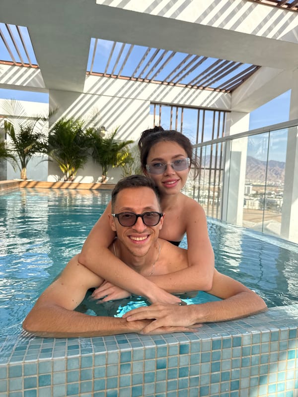 Couple enjoys luxury rooftop pool afternoon in Eilat