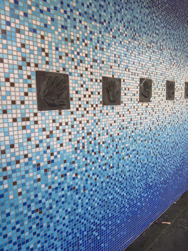 Tiled surfaces with hand plaques observed in Folkestone