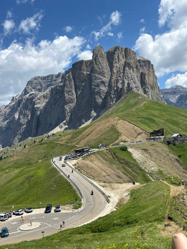 Morning exploring the Dolomites — meadows, roads, and mountain views