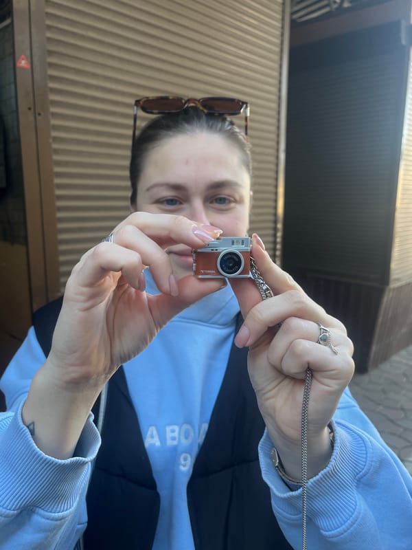 Woman documents pet store animals with camera necklace in Odesa