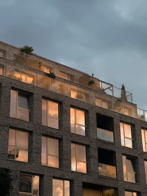 Sunset over Amsterdam apartments, yellow gifts in the foreground