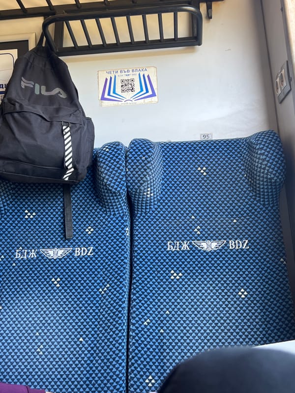 Train passenger documents journey through Bulgarian countryside near Mezdra